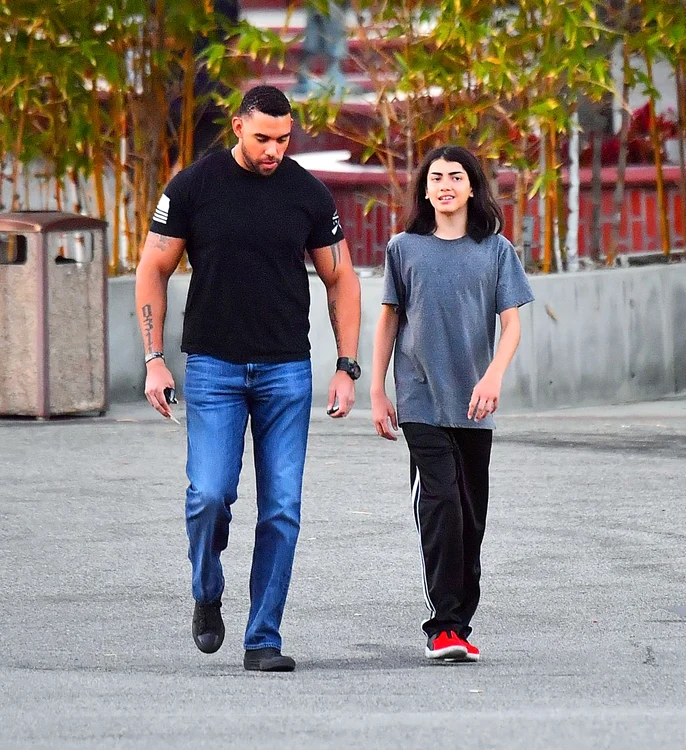 EXCLUSIVE: Michael Jackson's youngest son Blanket aka Bigi is almost as tall as his bodyguard while out in Encino, CA after dinner with sister Paris Jackson jpeg