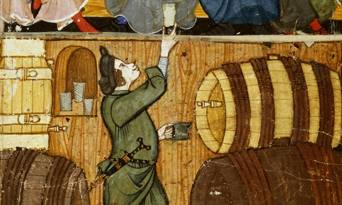 Un pivnicer printre butoaie. Miniatură medievală de la sfârșitul secolului al XIV-lea, aflată în colecția British Library (© Wikimedia Commons)