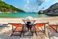 woman with hat sitting chairs beach beautiful tropical beach woman relaxing tropical beach koh nangyuan island jpg