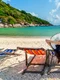 woman with hat sitting chairs beach beautiful tropical beach woman relaxing tropical beach koh nangyuan island jpg