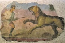 Frescă reprezentând o luptă între un gladiator și un leu (© Wikimedia Commons)