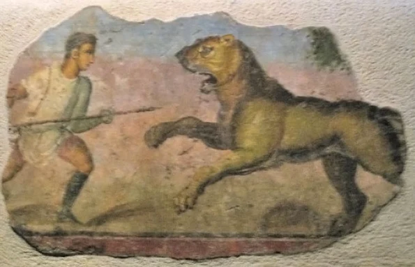 Frescă reprezentând o luptă între un gladiator și un leu (© Wikimedia Commons)
