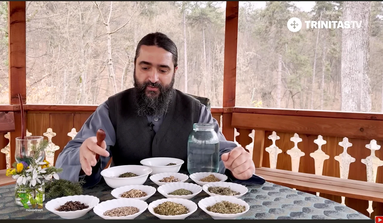 un preot în fața unor boluri cu ingrediente