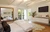 Liam Hemsworth's house cost $ 6 8 million It is a ranch style house 1950s Front is all window It has hardwood floors Apparently it has both window, but it's all super technologized, as the windows are handled easily by remote control jpeg