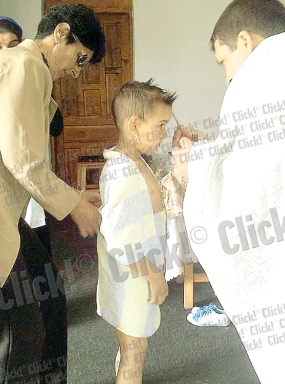 Gigi-Becali şi naşa sa, emoţionaţi în faţa preotului (Fotografii: Click!)