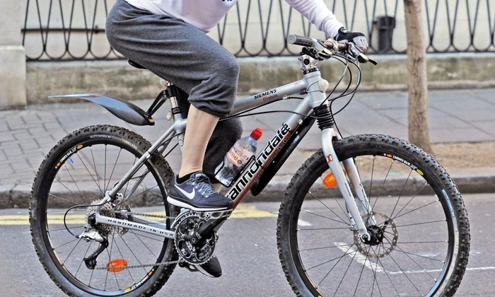 *EXCLUSIVE* WEB MUST CALL FOR PRICING   Superstar Singer Madonna pictured back in London! The singer was out enjoying the Heatwave as she's seen on her Bike with family and friends jpeg