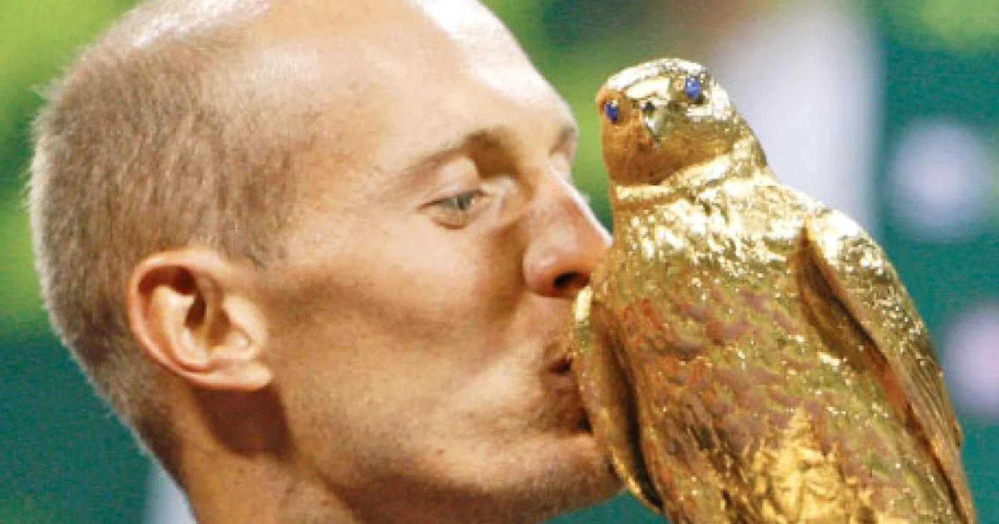 Davidenko şi trofeul câştigat la Doha 