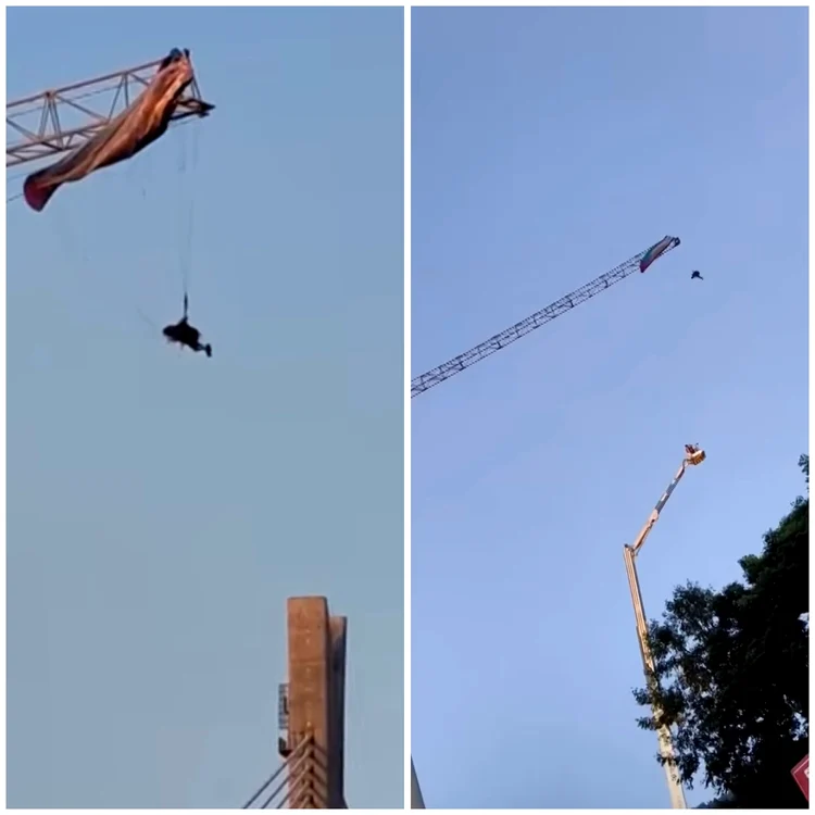 Parapantist rămas suspendat de o macara la zeci de metri/ sursa Youtube ABS-CBN News