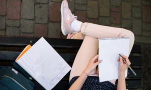 crop girl writing notepad jpg