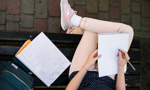 crop girl writing notepad jpg