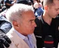 Călin Georgescu este însoțit de ofițeri de poliție la sediul DIICOT pentru audiere, în București. FOTO Inquam Photos / George Călin