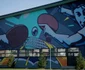 Pictura uriaşă de pe sala de sport din Dumbrăviţa