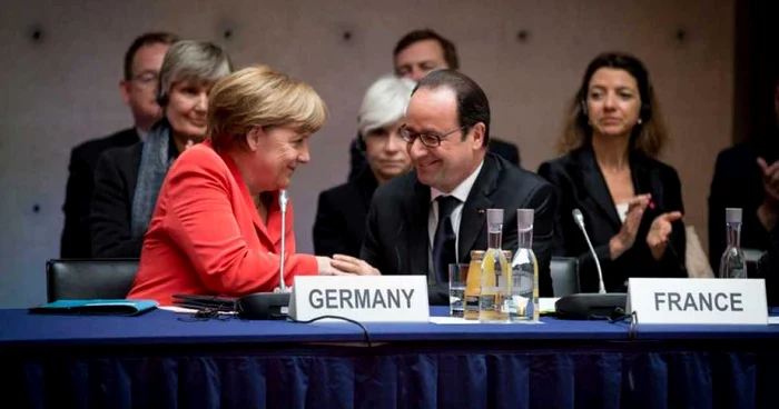 Cancelarul german Angela Merkel şi preşedintele francez Francois Hollande