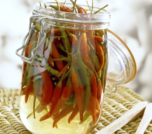 jar of hot green and yellow peppers in vinegar jpeg