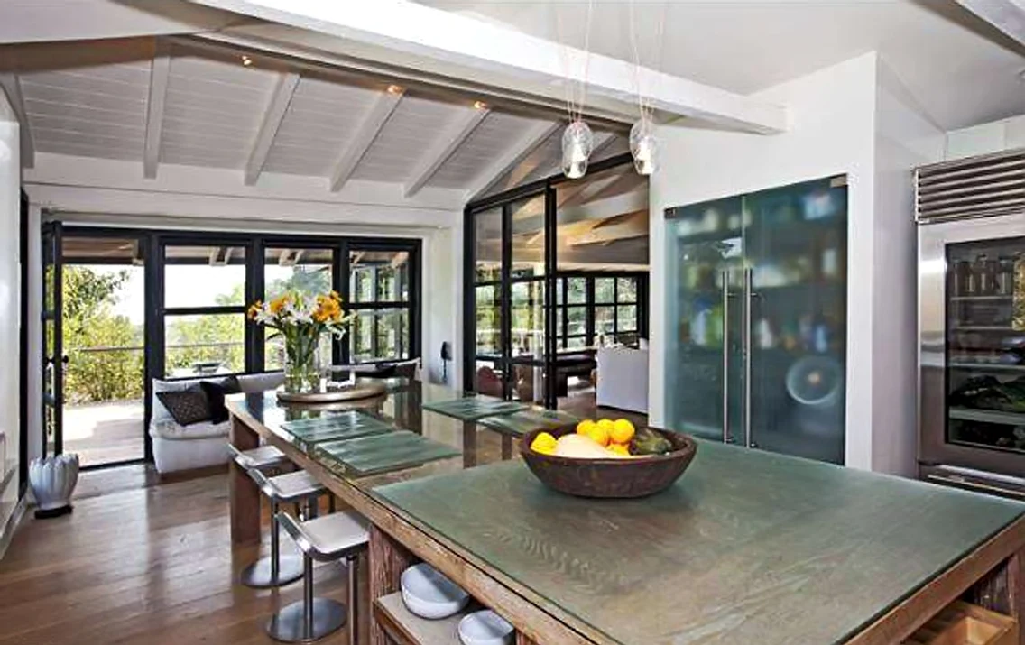Liam Hemsworth's house cost $ 6 8 million  It is a ranch style house 1950s Front is all window  It has hardwood floors Apparently it has both window, but it's all super technologized, as the windows are handled easily by remote control  jpeg