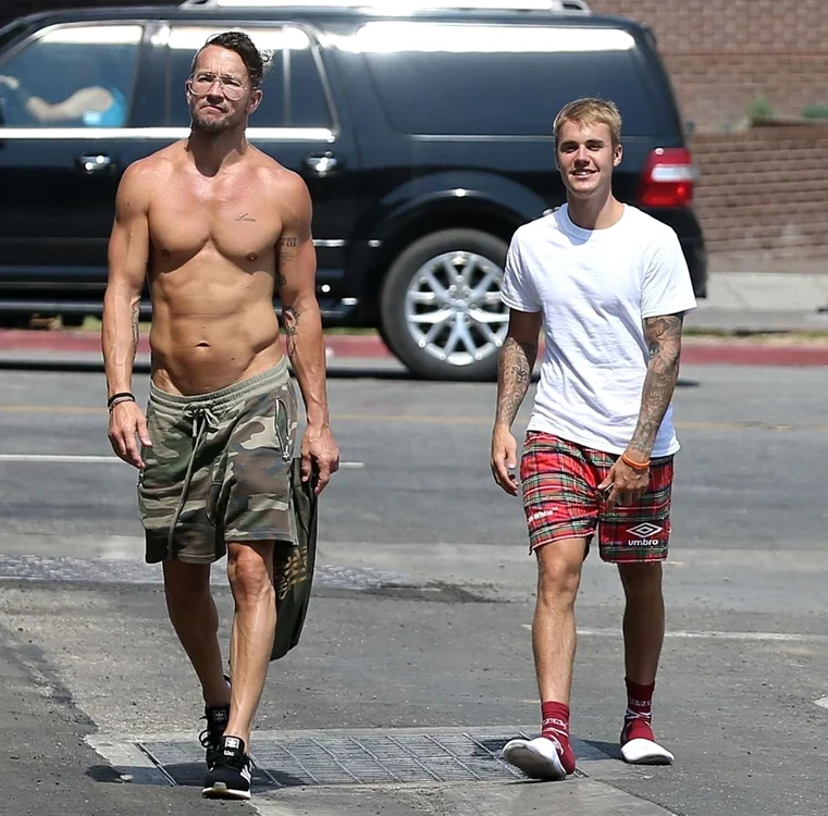 *EXCLUSIVE* Justin Bieber lays down in the grass with a couple of friends jpeg