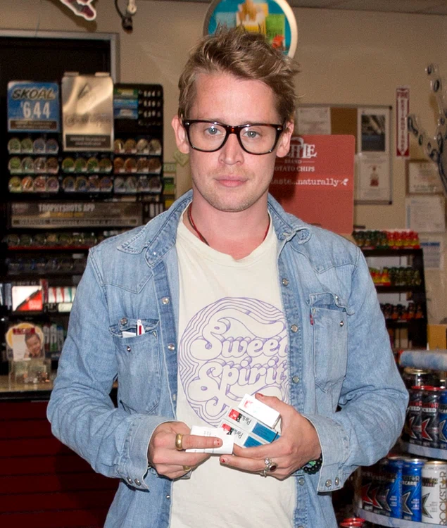 Macaulay Culkin was seen picking up Three packets of Parliament Cigarettes as a Gas station on Sunset Blvd in West Hollywood, CA jpeg