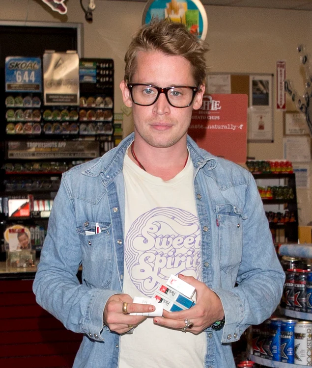 Macaulay Culkin was seen picking up Three packets of Parliament Cigarettes as a Gas station on Sunset Blvd in West Hollywood, CA jpeg