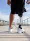 back view man with mechanical leg sunny day sportsman black shorts white sneakers photographed training sport disability hobby concept jpg