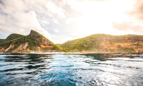breathtaking view ocean cliffs covered with plants captured lombok indonesia jpg