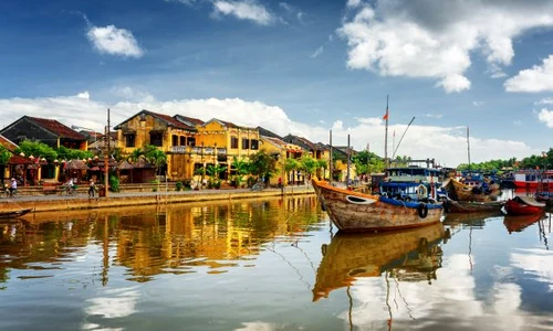 Wooden boats on the Thu Bon River in Hoi An, Vietnam jpeg