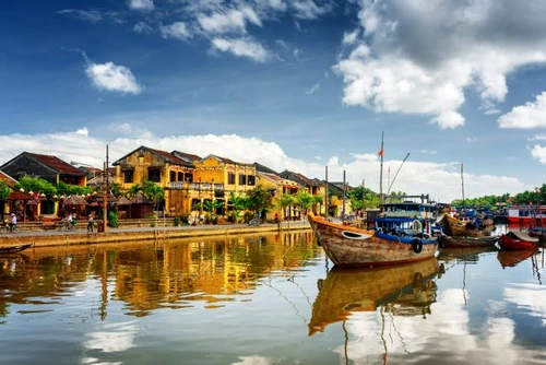 Wooden boats on the Thu Bon River in Hoi An, Vietnam jpeg