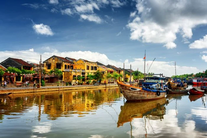 Wooden boats on the Thu Bon River in Hoi An, Vietnam jpeg