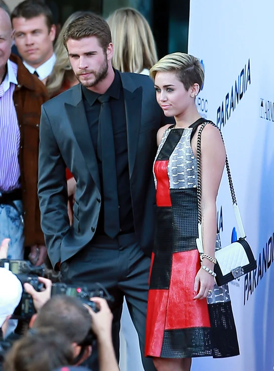 Liam Hemsworth & Miley Cyrus Attend 'Paranoia' Premiere Together jpeg
