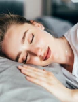 beautiful young brunette woman sleeping white bed jpg