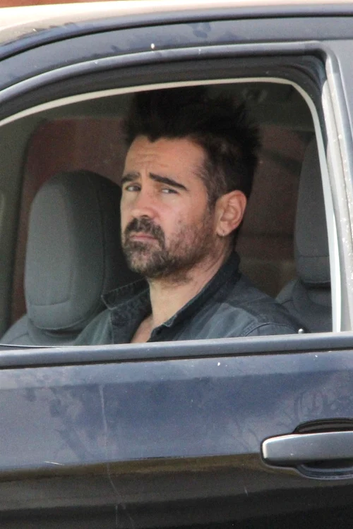 Scruffy looking Colin Farrell stops his truck to look for something in Los Angeles jpeg