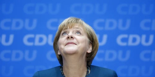 Cancelarul german Angela Merkel zambeste la o conferinta de presă in Berlin foto reuters