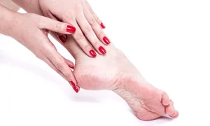 1 lady applying cream to foot jpg jpeg