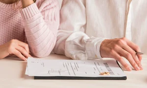 close up couple with divorce decree jpg