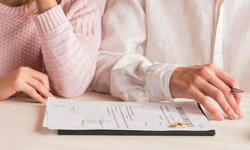 close up couple with divorce decree jpg