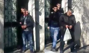 Hoții au fost încătușați și duși în arest  jpeg