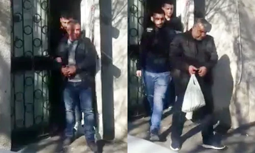 Hoții au fost încătușați și duși în arest  jpeg