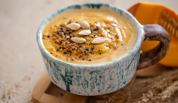delicious composition with pumpkin soup beautiful ceramic dish seasonal food jpg
