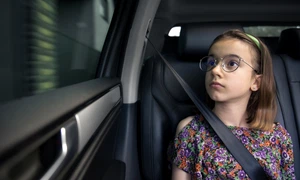 girl is sitting car way school jpg