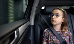 girl is sitting car way school jpg