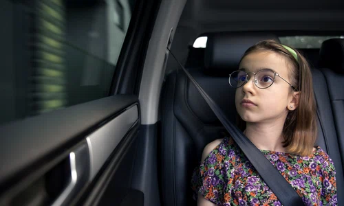 girl is sitting car way school jpg