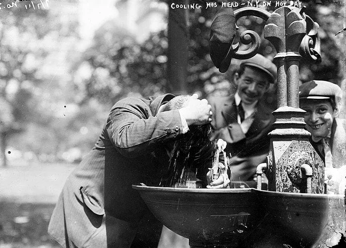 New York heat wave in 1911 Man cooling his head jpg
