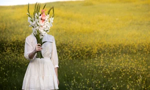 young woman with gladiolus nature jpg