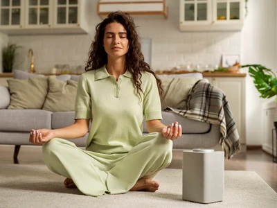 full shot woman meditating home (1) jpg
