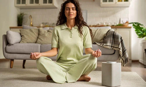 full shot woman meditating home (1) jpg
