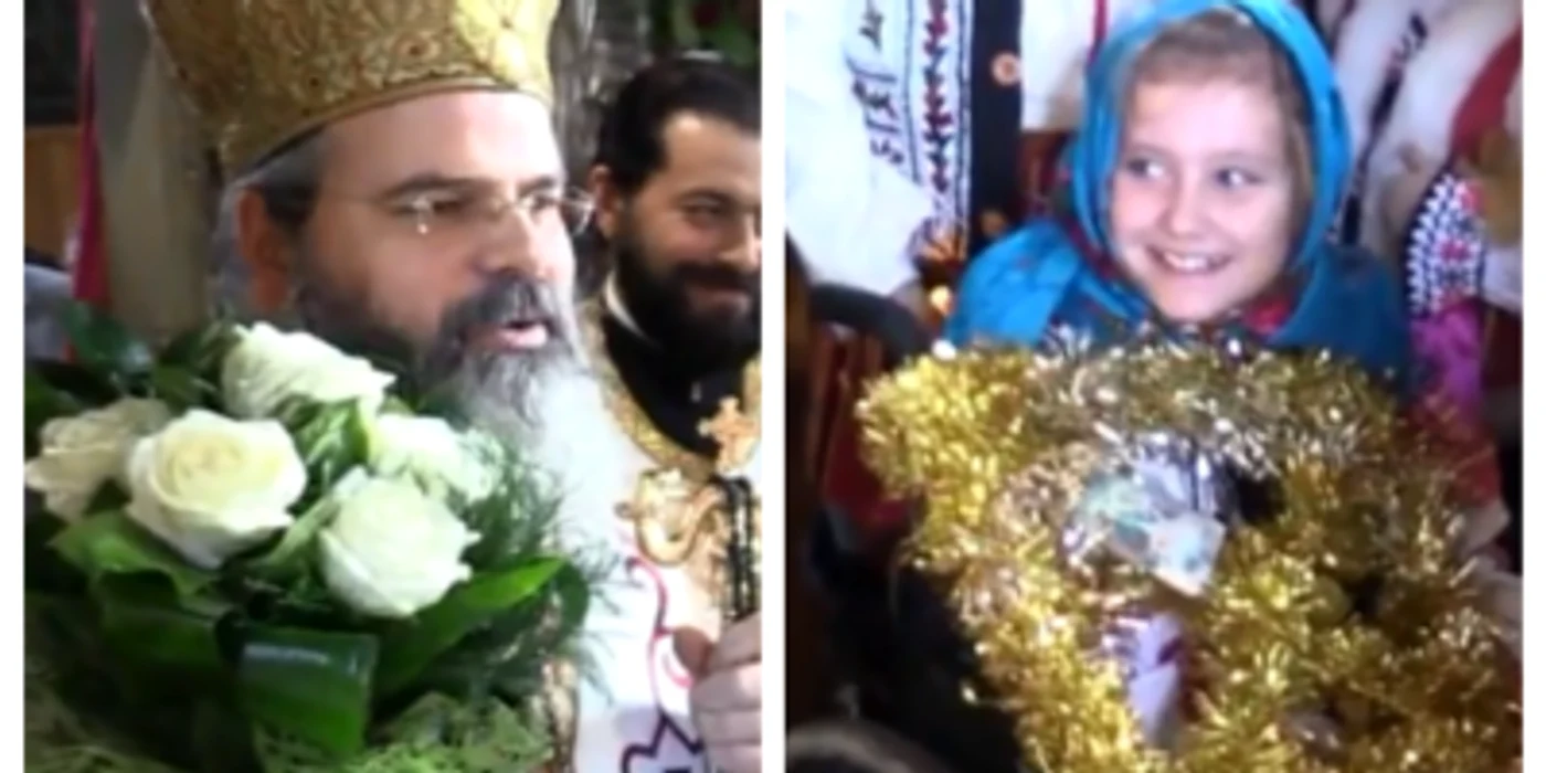 Episcopul Huşilor dăruieşte credincioşilor toate buchetele de flori pe care le primeşte