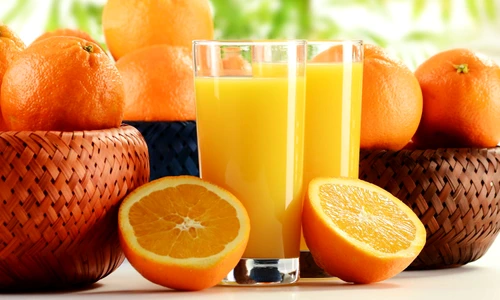 9110288   two glasses of orange juice and fruits jpeg