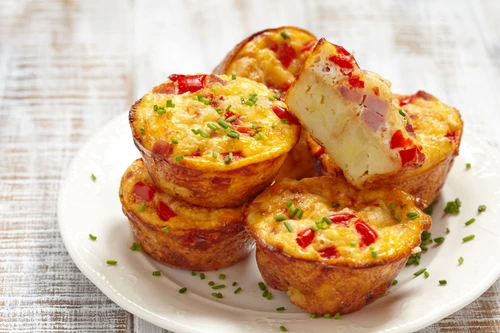63568992 delicious egg muffins with ham, cheese and vegetables jpeg