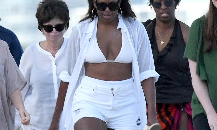 EXCLUSIVE: **PREMIUM EXCLUSIVE RATES APPLY* ***NO WEB BEFORE 9AM EST JAN 15TH** Michelle and Malia Obama show their great swimsuit figures as they hit the beach in Miami jpeg