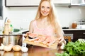 smiling woman with salmon jpg