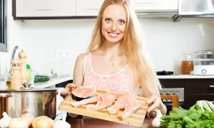 smiling woman with salmon jpg